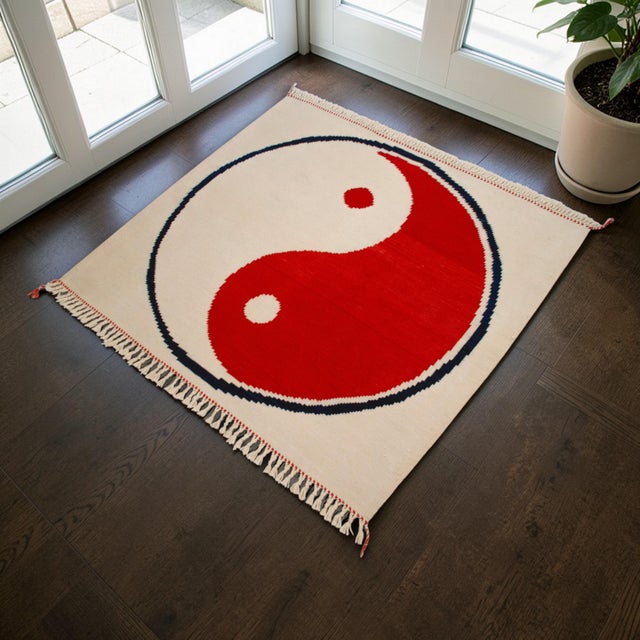 This striking hand-woven kilim, originating from Western Anatolia, masterfully bridges the gap between traditional Turkish...