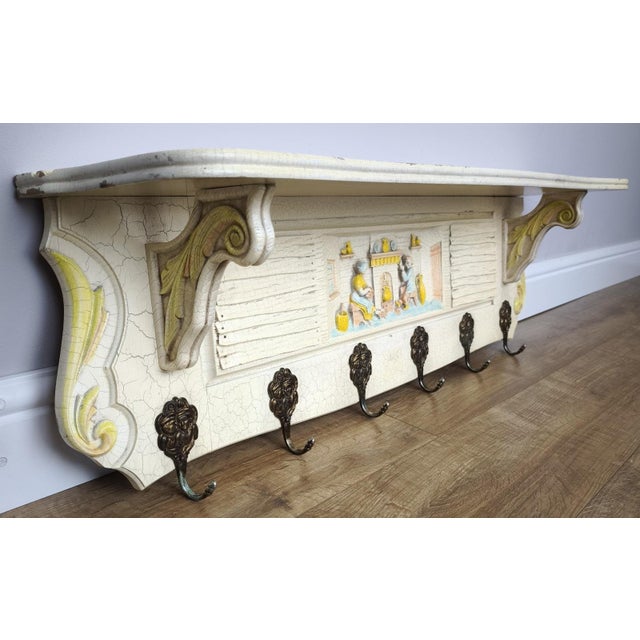A charming Vintage shabby chic coat hanger, beautifully designed with decorative detailing and a soft aged finish, perfect...