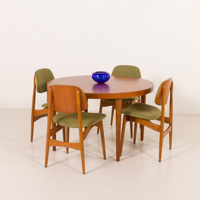 This set of four Scandinavian mid-century chairs, resembling very much the style of Arne Hovmand-Olsen, reflects the...