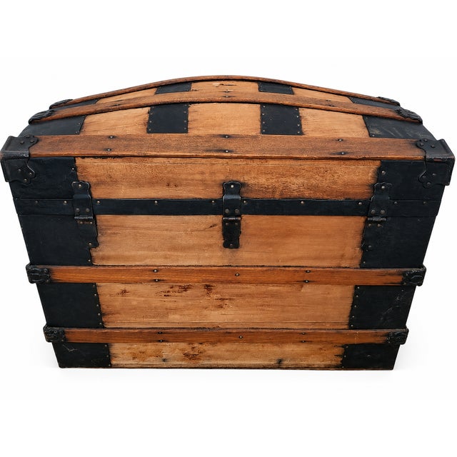 Bring timeless character to your home with this authentic late 19th-century Victorian dome top steamer trunk. Featuring...