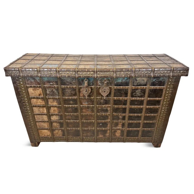 Antique wood and metal work dowry trunk/console table from India. Rich aged patina and original paint remnants with lots...