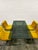 Table with six armchairs, featuring a chromed steel frame, black glass top, and six chairs upholstered in short-pile...