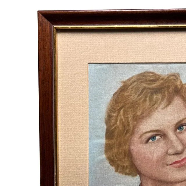 A mid-century modern portrait painting of a woman on blue silk. This portrait is professionally framed in a rectangular...