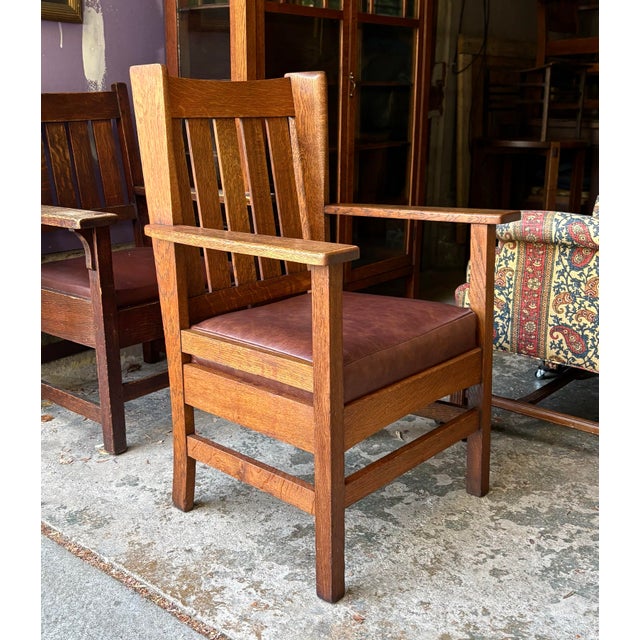 Gorgeous old chair that has had its finish, cleaned up and waxed along with a new leather upholstered seat.