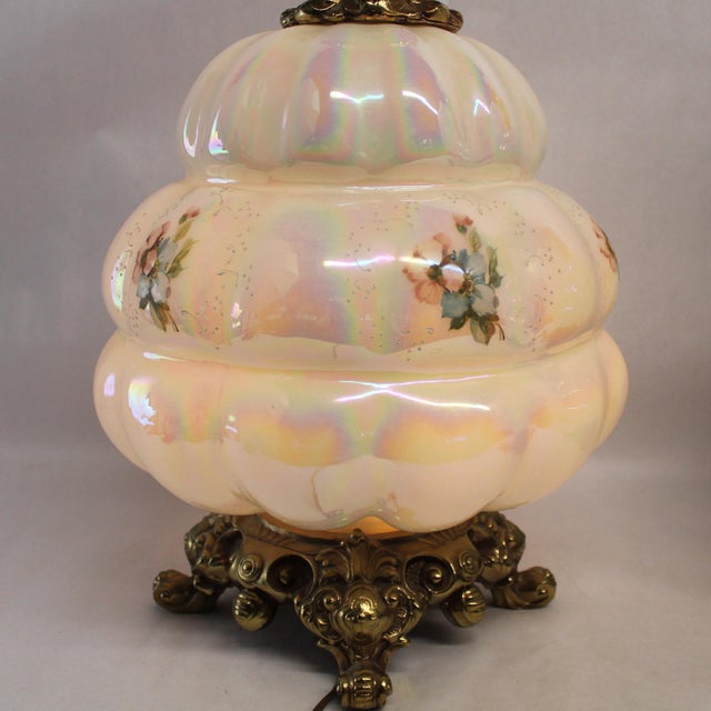 Enhance your décor with this lot of 2 opaline glass table lamps featuring a beautiful white floral design. The lamps are...