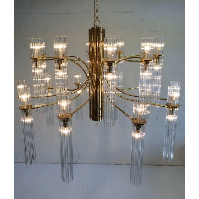 Huge brass and glass chandelier, 50” in diameter, chandelier has 20 arms with 260 glass rods.