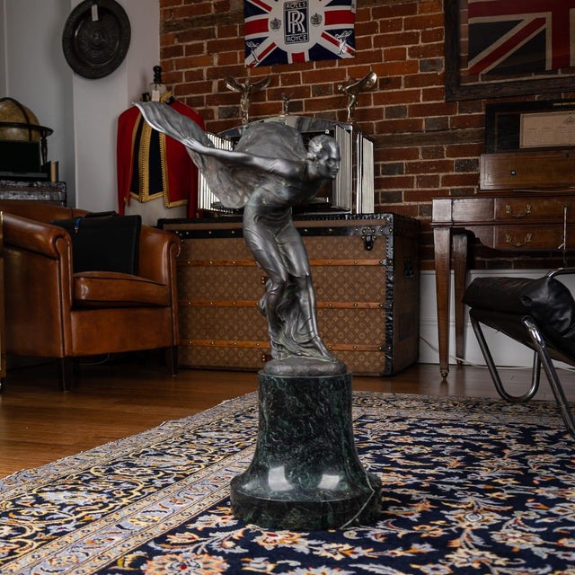 A 20th century british showroom display bronze of the legendary rolls-royce mascot which was designed by charles sykes...