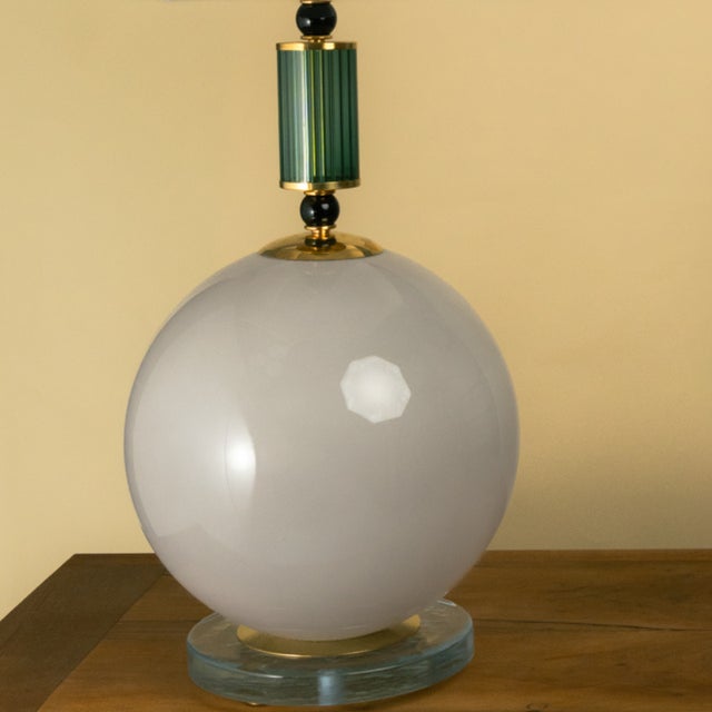 These lamps feature a clear glass base with a large, spherical Murano glass body in a gray color with an iridescent...