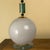 These lamps feature a clear glass base with a large, spherical Murano glass body in a gray color with an iridescent...