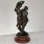 19th Century Statue of Lovers in Spelter on Faux Marble depicts two young lovers in classical raiment enjoying their...