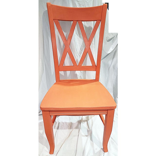 Solid and sturdy and solid wood side chair freshly painted in Annie Sloan's rich Coral Chalk Paint® crossed ladder back,...