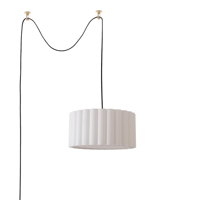 The Scallop 15" Kit is a contemporary lighting solution featuring a Drum White Linen Shade that complements its Weathered...