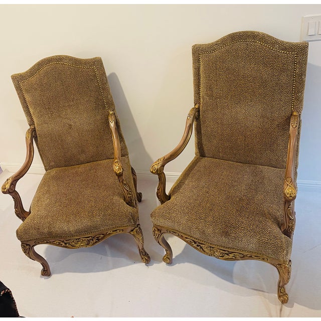 Spectacular pair of large Regency lounge armchairs in cheetah velvet upholstery with nails trim, carved decor with gold...