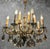 Exceptional french louis xv / rococo style chandelier featuring sixteen light points and an elaborately cast gilt bronze...