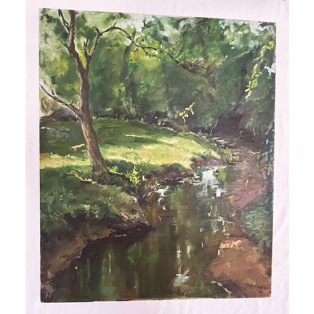 Original signed oil painting on canvas possibly from the 1930's. This serene piece depicts a pretty landscape with a tree...