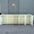 A striking Postmodern credenza showcasing a sculptural sawtooth wave façade in a warm cream woodgrain finish. The clean,...