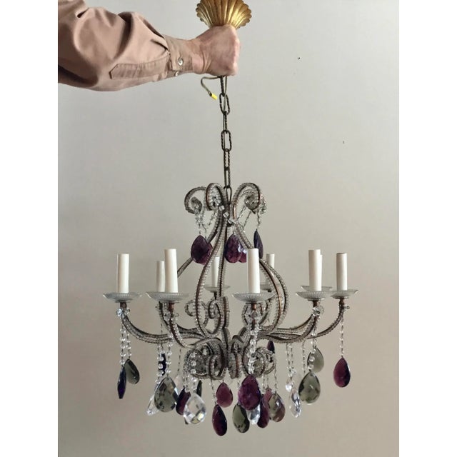 Unique vintage chandelier circa late 1950's with a mixture of colored and transparent tear drops. Transparent tiny...