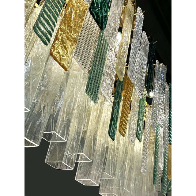 Scenographic italian hand-made chandelier with multicolors strip “listelli”, elements of Murano glass. Huge rectangular...