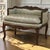 Elegant in both scale and craftsmanship, this 19th century French Louis XV vanity armchair is a beautifully preserved...