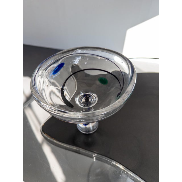 A stunning and sculptural art glass bowl designed by Vicke Lindstrand for Kosta, Sweden. The piece features his signature...