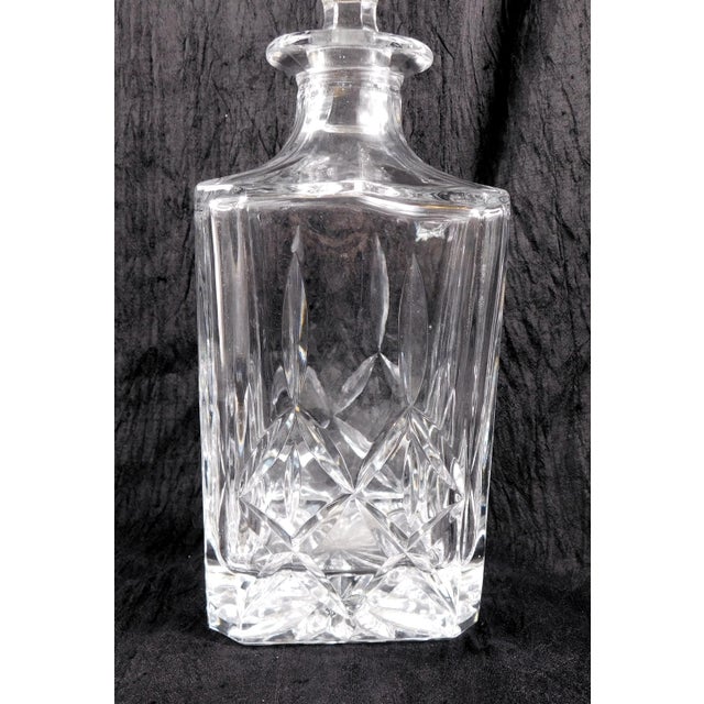 This is a square, cut crystal whisky decanter by Block in the Olympic pattern. It has the wrong stopper. The included...