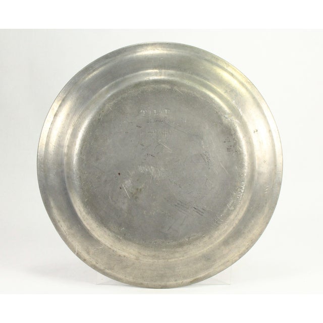 An impressive early pewter plate or charger Single cast reed, normal width rim Nicely marked at the bottom with two...