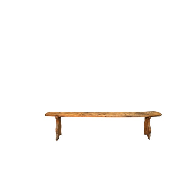 A 19th-century fir wood bench, characterized by clean lines and a simple structure. Solid and functional, it retains a...