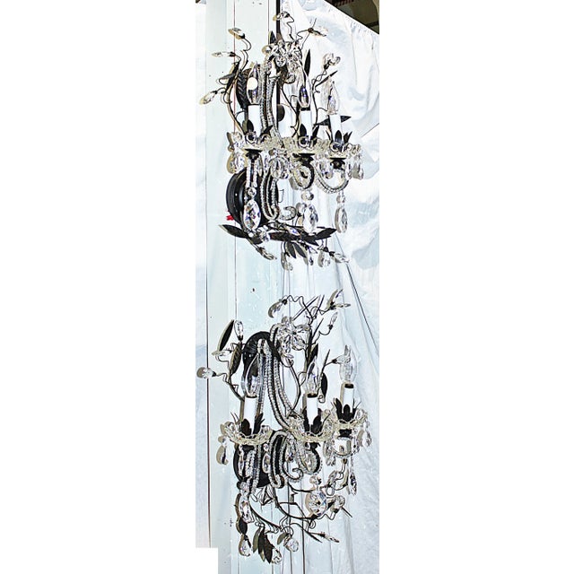 Modern yet classical, bronze painted metal and crystal wall sconces with leaves and crystal buds in a free form organic...