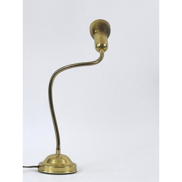 Lovely mid-century modern gooseneck brass table lamp or desk light. Due to the flex arm, adjustable in various position...