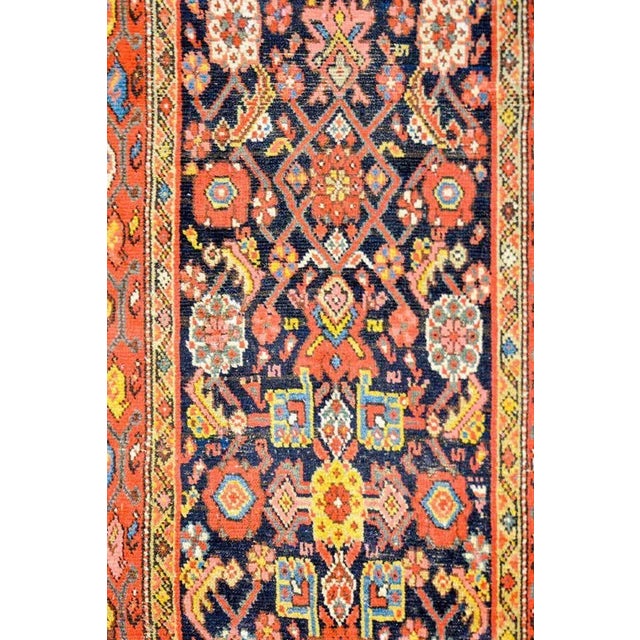A wonderful early 20th century Persian Malayer runner with all-over multicolored trellised floral and vine pattern woven...