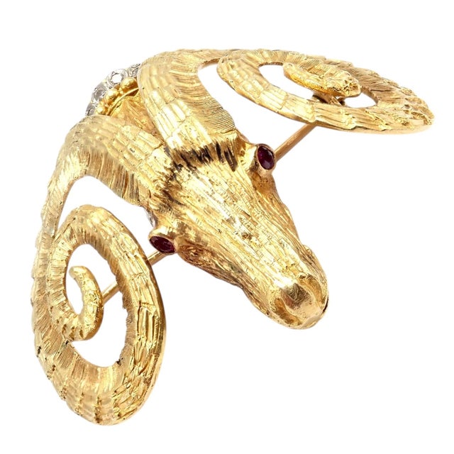 This rare Greek Ilias Lalaounis brooch showcases exquisite artistry in 18k yellow gold, sculpted as a majestic ram...