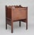 This 18th century mahogany bedside cupboard features a lift-up hinged top. The front of the cupboard has a panel which...