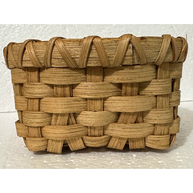 Light colored natural woven wicker basket that is a great size for holding paper napkins. It is approximately 6” long x 6”...