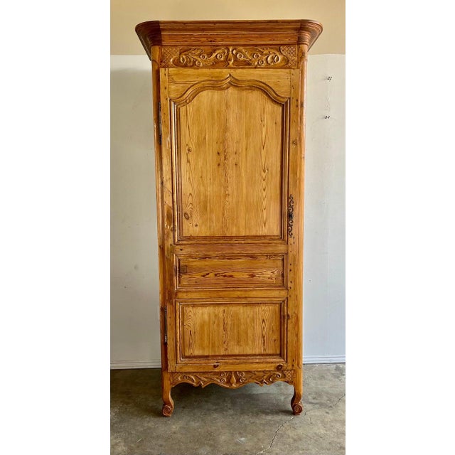 19th C. French Provincial style pine cabinet. There is one door that reveals great storage. The piece stands on four...