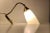 Early 1950s wall light made in Scandinavia in a style reminiscent of Stilnovo and the french modernist movement. Its...