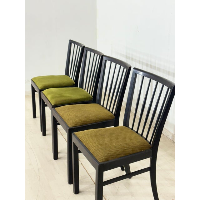 For sale is a set of four vintage dining chairs from the 1960s. The chairs impress with their simple, elegant design,...