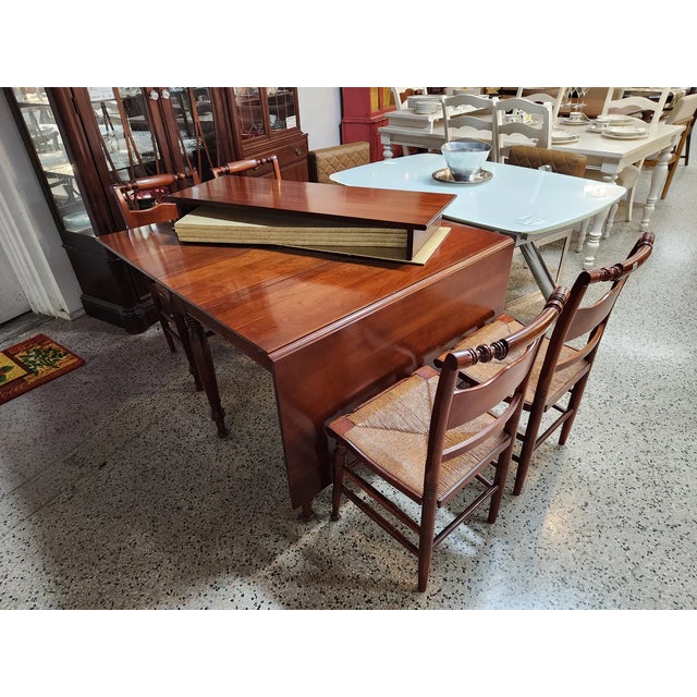Willett Wildwood Antique Cherry Drop Leaf Wood Dining Table with Four Chairs 72"wide x 44" Deep with both Drop Leaves up...