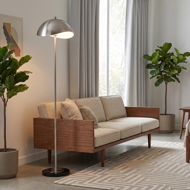 Satin nickel Steel paired with a black marble base defines the Luna Bella Slimline Floor Lamp, a Mid-Century Modern design...