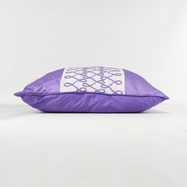 Add a soothing touch of elegance with this purple accent pillow, showcasing an infinity symbol-inspired embroidery on a...