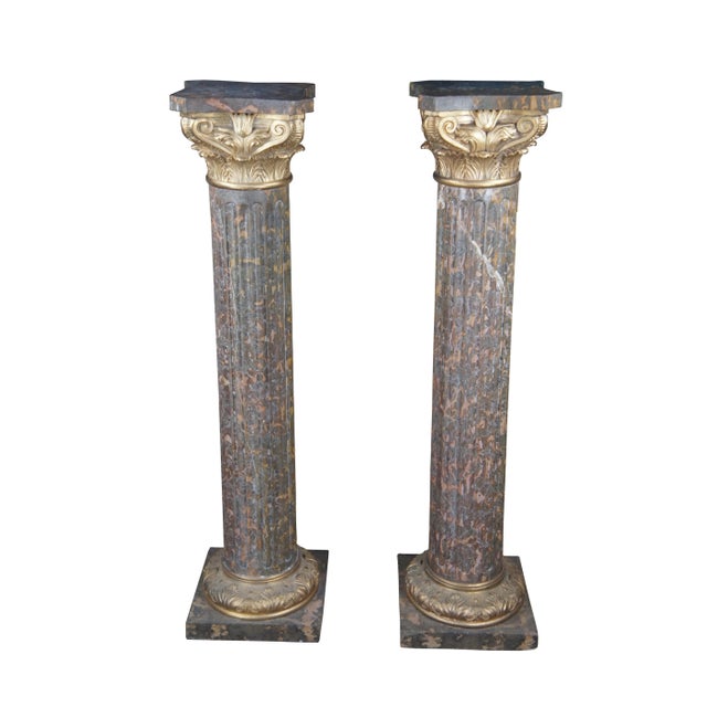 A large pair of Classical Column Napoleon III style Pedestals. Made from Tiger Gold Marble and Gilt Bronze. Features a...