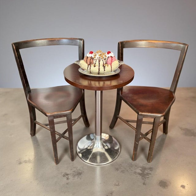 Pair of authentic early 20th century Seatmore café chairs, circa 1915–1930. Produced in the American Midwest under the...