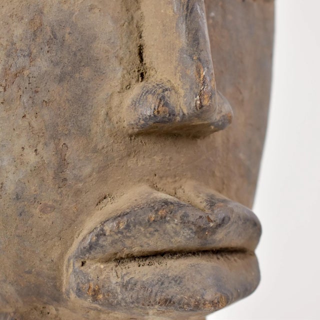 The Baule people, residing in CÃ´te d'Ivoire, West Africa, are renowned for their masterful artistry in crafting portrait...