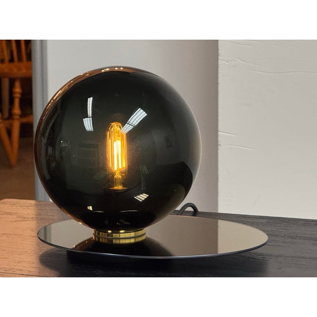 Design Plus Gallery presents the Umbra Table Lamp by DECHEM Studio for Bomma. The lamp is inspired by spatial geometry and...