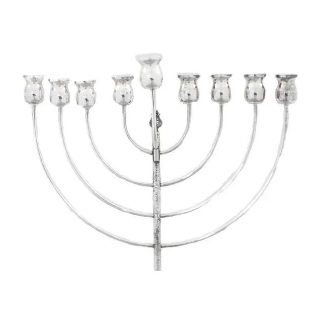 Just in time for Hanukkah 2023, this stunning menorah! Sterling silver and uber-modern, this menorah is a show stopper. It...