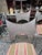 Mid-Century Modern bar stools designed for indoor or covered patio use. They feature a distinctive "bowtie" or "hourglass"...