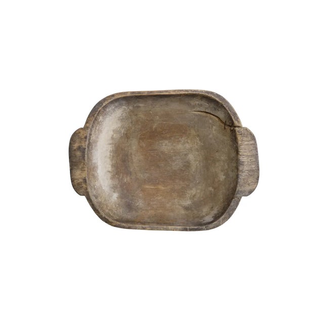 The 19th-century French Wooden Dough Bowl is a rustic, hand-carved kitchen essential that embodies the charm and...