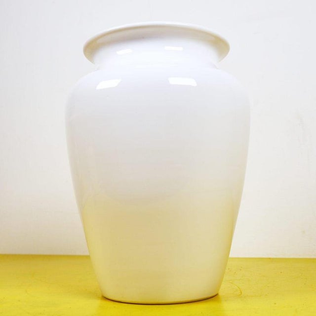 This vase, with its simple design, is a perfect example of elegance and functionality. Crafted from glazed terracotta, its...