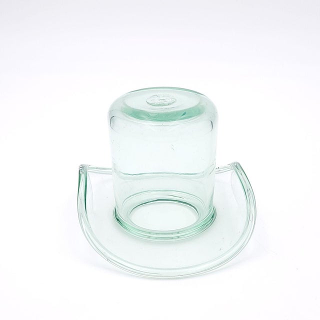 A Victorian glass top hat, made for a groom. (The bride often was given a handmade glass shoe.) England, circa 1880.