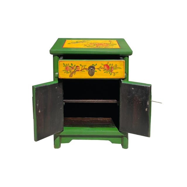 This is a handmade Chinese accent decorative end table nightstand with a distressed green rim yellow doors base color. The...