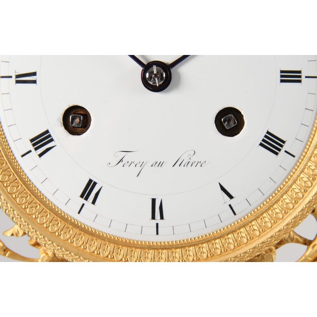 Small mantel clock with bas-relief france bronze, enamel early 19th century dimensions: h x w x d: 33 x 19 x 9 cm antique,...